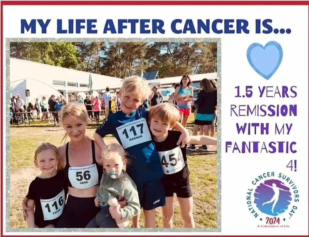 A woman in athletic wear poses with four children, each wearing race bibs, celebrating 1.5 years in remission from cancer at a survivor event.